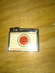 lot 946 image: Lucky strike lighter