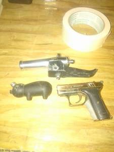 lot 952 image: canon, pig, and gun lighters