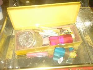 lot 967 image: Decorative tin container with random items