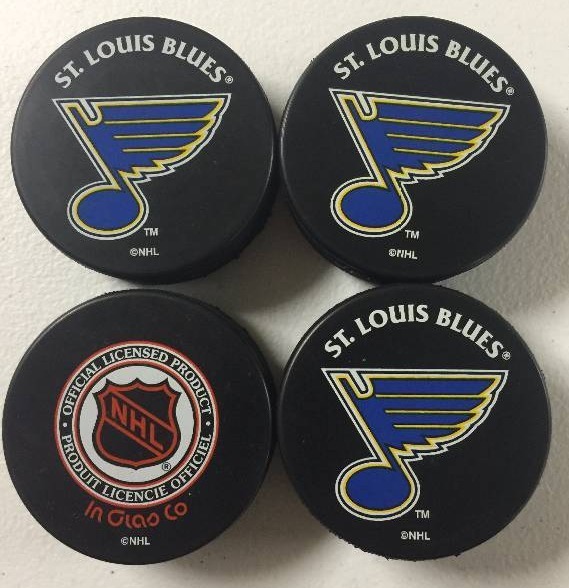 lot 1067 image: Four St. Louis Blues Game Quality Pucks