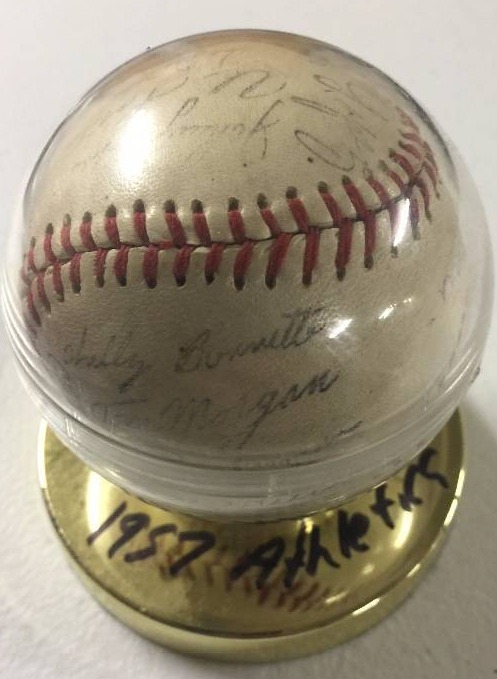 lot 1069 image: 1957 Kansas City Athletics Team Signed Baseball Stamped Stadium Souvenir