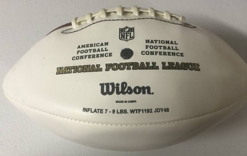 lot 1169 image: Official NFL White Panel Wilson Football Signed by Kansas City Chiefs Punter Dustin Colquitt