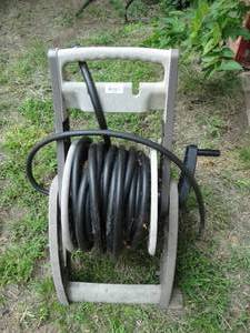 lot 38140 image: Rolling Hose Reel with Garden Hose