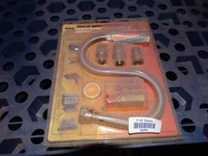 lot 38096 image: Universal appliance hook up kit- new in package