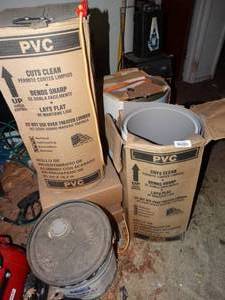lot 38126 image: Bucket of ProMar Hi-Bilt Lacquer Satin and Rolls of PVC Aluminum Siding Trim