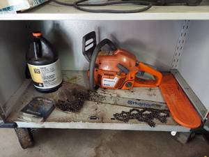 lot 1037 image: Husqvarna 340 Chainsaw with Chains and Bar Oil (About 14 Full)