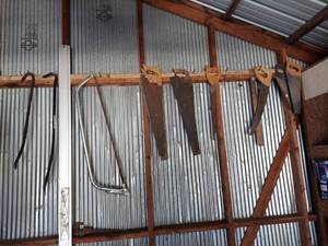 lot 1179 image: all Hanging saws and pry bars