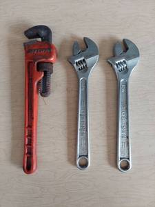 lot 1125 image: Craftsman adjustable wrenches and pipe wrench