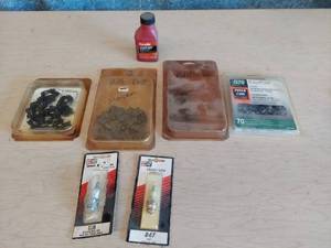lot 1181 image: chainsaw chains and spark plugs
