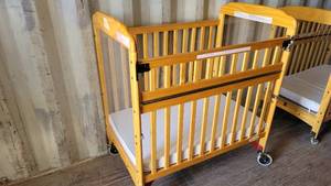 lot 1227 image: Fire Evacuation Rounded Wooden Frame Crib