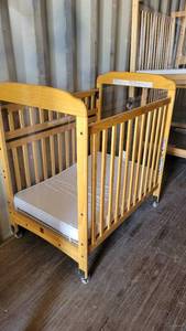 lot 1230 image: Rounded Top Wooden Frame Crib on Casters