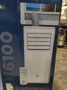 lot 55245 image: GE Portable Air Conditioner. (tested, works cold)