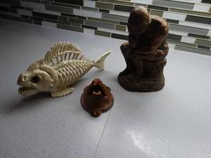 lot 1266 image: Thinker statue Plastic bone fish Bear head bottle opener