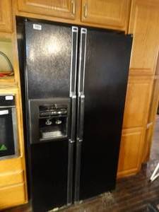 lot 1268 image: Kenmore Black side x side refrigerator w ice & water in door-