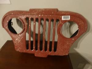 lot 1341 image: Jeep grill wall art