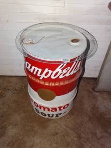 lot 1450 image: Campbells Tomato soup painted metal barrel w glass top
