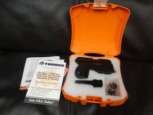 lot 1002 image: Taurus .380 CURVE handgun in box w 2 magazines- Laserflashlight