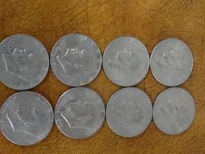 lot 1008 image: 8 IKE silver dollars