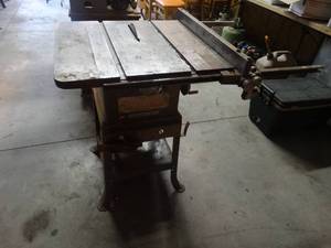 lot 1501 image: Rockwell Delta table saw on stand