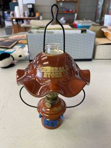 lot 23 image: General store oil lamp, small.