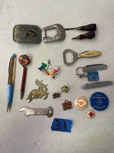 lot 31 image: Misc treasure, pin backs, pocket knives, belt buckles, mini wood screwdrivers and more