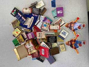 lot 57 image: Large Quantity of matches, matchbook covers and 2 smokey the bear magnets.