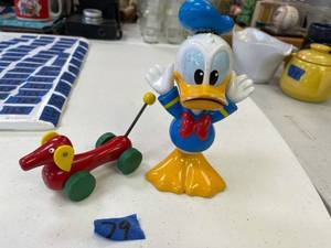 lot 79 image: Talking donald duck, untested. wood toy red dog on wheels.