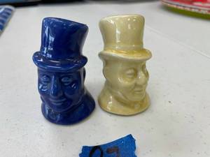 lot 97 image: uncle sam blue and yellow shakers, with corks.