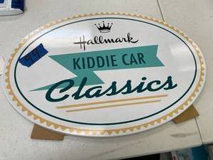lot 99 image: Hallmark kiddie car classics sign for display