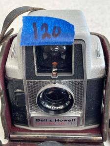 lot 120 image: Bell and howell electric eye camera, with complete leather case.