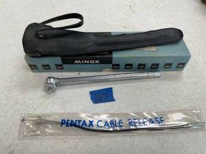 lot 127 image: Minox Pocket tripod, pentax cable release