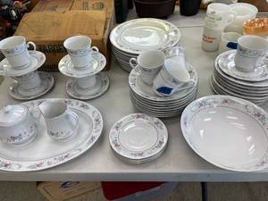 lot 147 image: Fine porcelain by north ridge china set, platter, sugar and cream, serve bowl, soup bowls, plates & tea cups with saucers.
