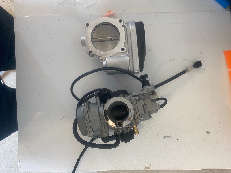 lot 7164 image: NEW THROTTLE BODY AND CARBURETOR and NEW SMALL ENGINE CARBURETOR PINK HOSES