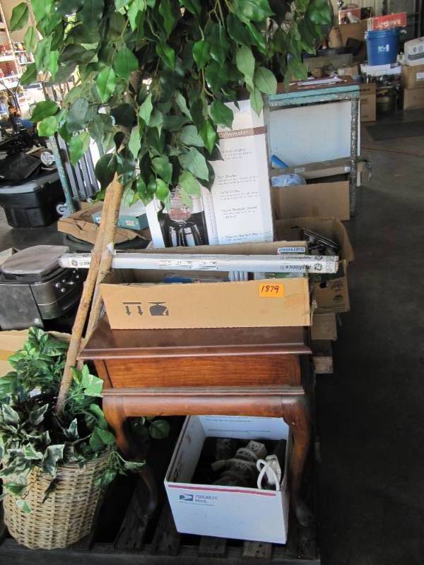 lot 2232 image: OFFICE PALLET  INCLUDES COFFEE MAKER,  FAUX 6 PLANT, TABLE, LIGHTBULBS & MISC