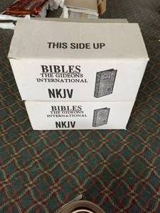 lot 1129 image: Two cases of brand new bibles