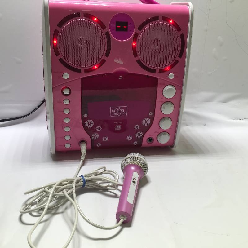 lot 1031 image: PINK SING MACHINE