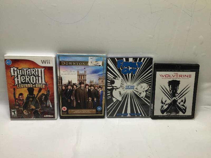 lot 1072 image: GAMES MIX GUITAR HEROFAMILY GUYVOLVERINEDOWNTON ABBEY