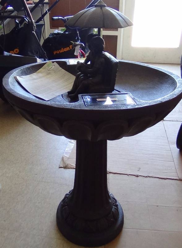 lot 3271 image: Smart Solar Umbrella Series Solar Fountain, Boy and Girl Reading on a Bench