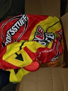 lot 4197 image: SPORTSSTUFF Towable Booster Tube Yellow, Red, Black, Dimensions inflated (38in x 28in) deflated (45in x 36in)
