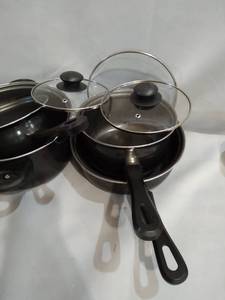 lot 12384 image: BLACK POTS ,PANS USED