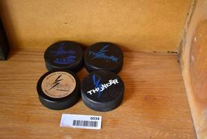 lot 6034 image: Lot of 4 Wichita Thunder Hockey Pucks