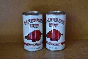 lot 6057 image: 2 Cans Razorback Beer  One Full, One Empty