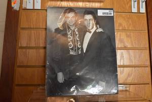 lot 6055 image: Photograph of Elvis Presley and Johnny Cash  14 x 11
