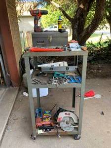lot 6090 image: Rolling Metal Shelves Full of Tools  Black and Decker Hand Drill, Circular Saw, Staple Gun, Etc.