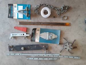 lot 7004 image: Lot of Assorted Garage Door Repair Supplies  Hinges, Rollers, Etc.