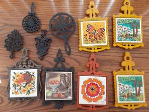 lot 7084 image: Vintage Lot of 10 Trivets  Cast Iron, Tile