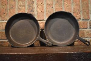 lot 7088 image: Lot of 2 Cast Iron Frying Pans  Marked on bottom  10 58