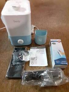 lot 3607 image: Lot of Cleaners  Two Waterpik Flossers, Jewelry Cleaner, and Humidifier