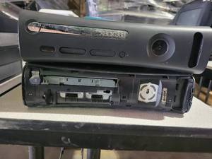 lot 35335 image: Lot of 2 XBOX 360s - Untested - No Chords - One is Parts Only
