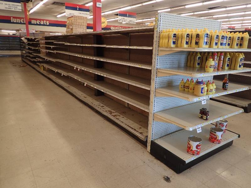 lot 4240 image: Entire Row of Adjustable Double Sided Merchandise Shelving
